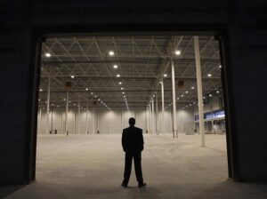 man-standing-in-a-wearhouse